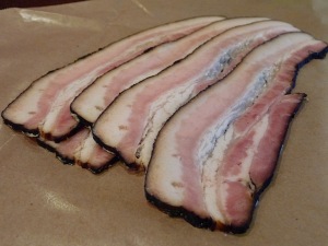 slices of bacon on butcher paper
